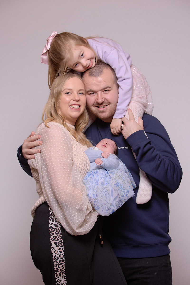 Mum, Dad, daughter and baby